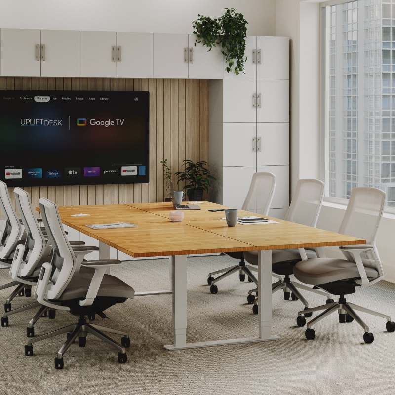 UPLIFT Height Adjustable Conference Table with a bamboo desktop to create an ergonomic meeting space