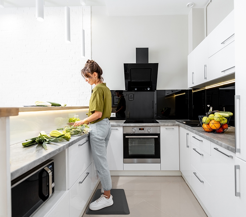 Use the anti-fatigue Standing Desk Mat in the kitchen