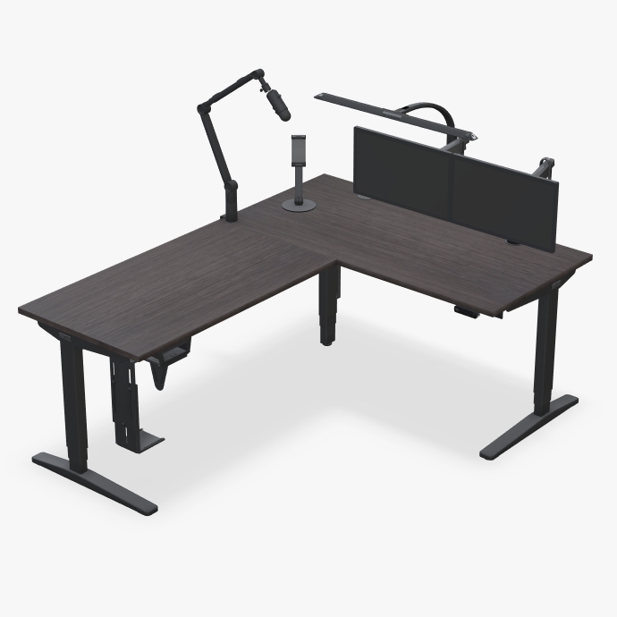 UPLIFT L-shaped standing desk with streamer accessories.