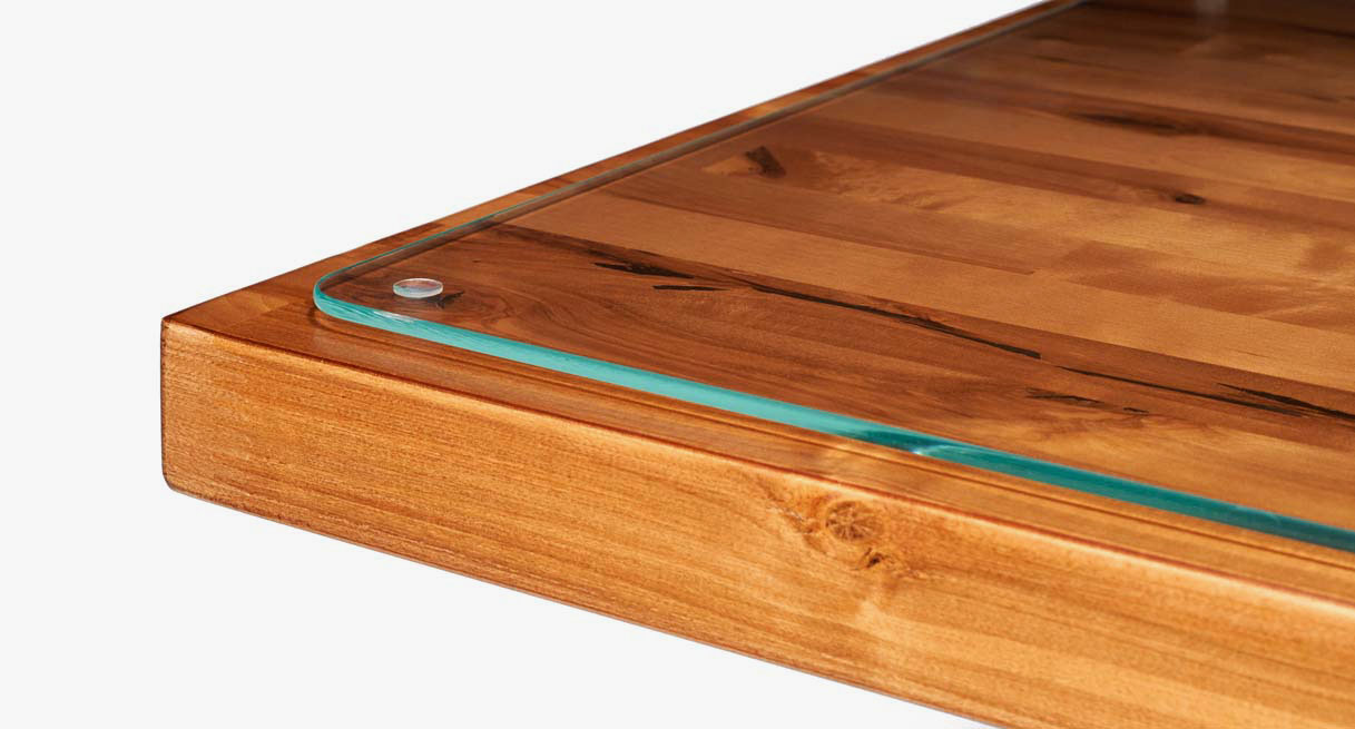 A close-up of the Optiwhite glass of a Glass Desk Blotter