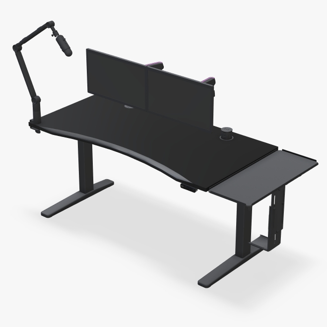UPLIFT standing desk with black eco curve desktop and gaming accessories.