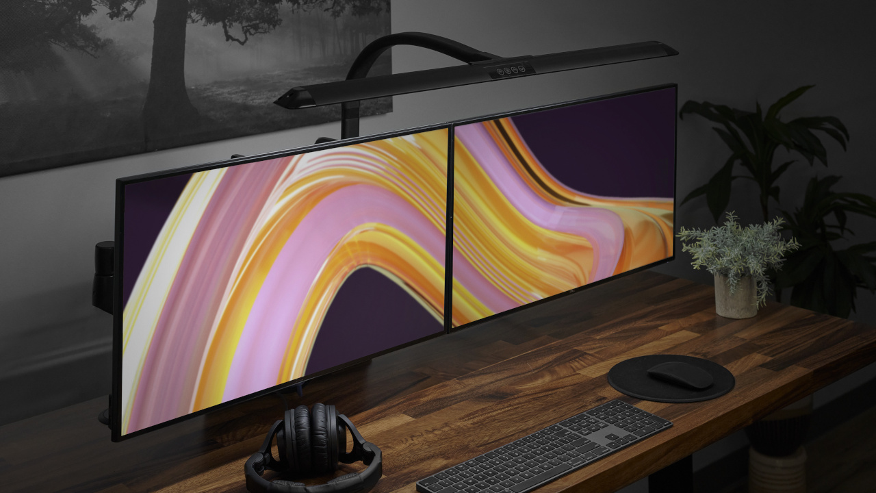 Black Sliding Flex Lamp illuminating desktop area.