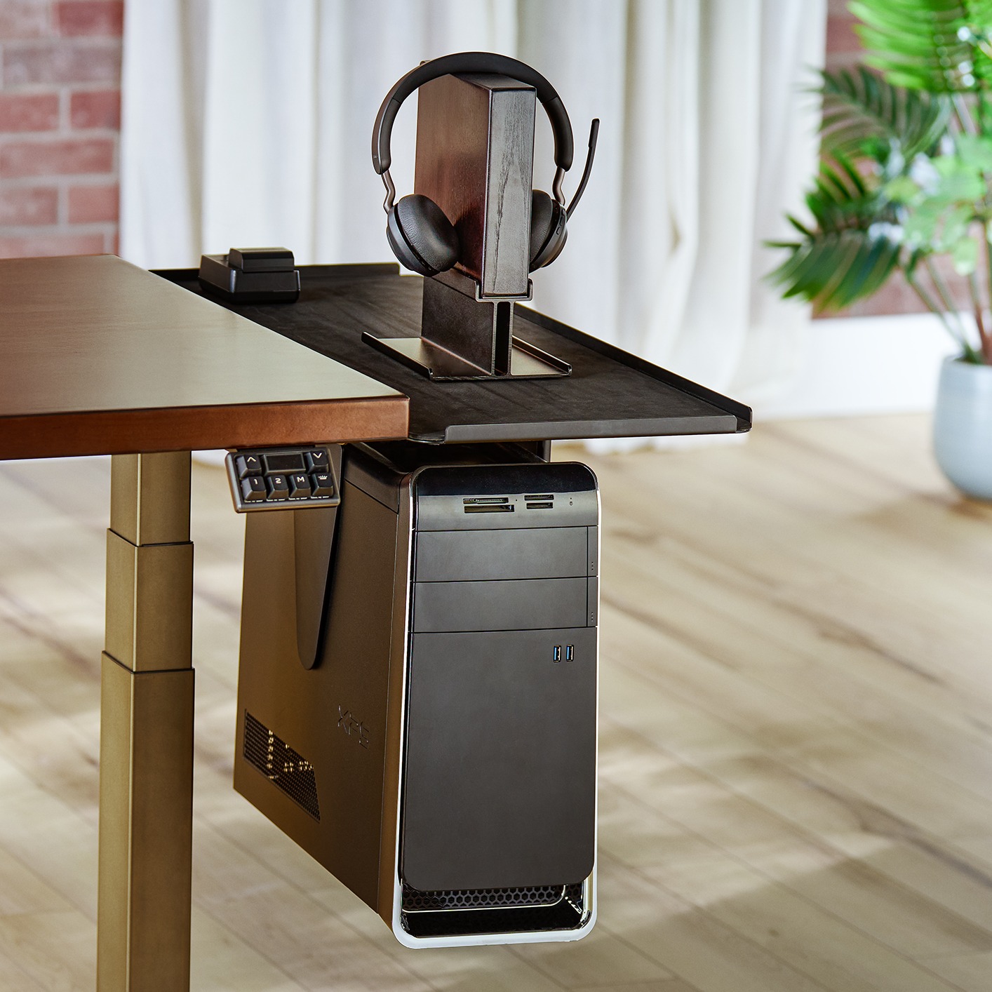 Desk Extension by UPLIFT Desk expanding surface area for a gaming setup.