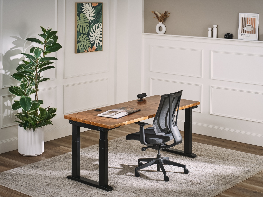 UPLIFT Clarksville Ergonomic Chair in black at an UPLIFT V3 4-leg height adjustable desk in a home office.
