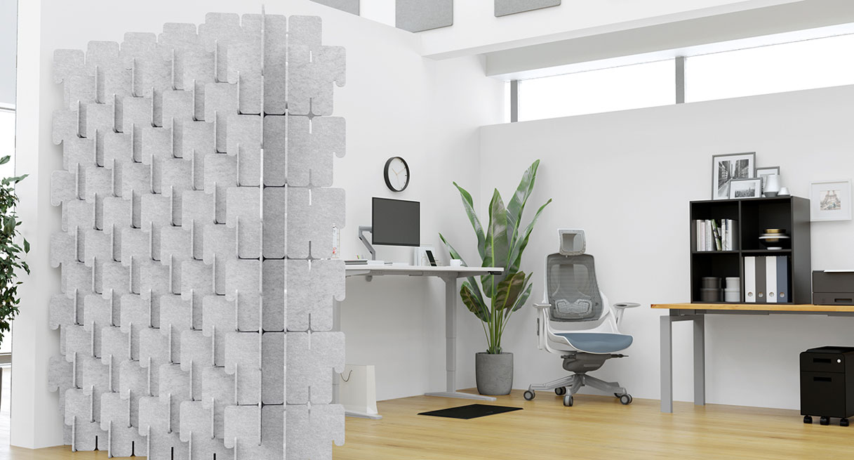 Light gray Bonnell Acoustic Puzzle Wall defining a workspace