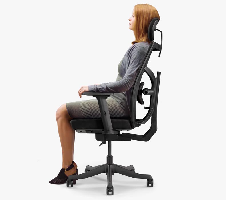 A person sitting in a Facet Ergonomic Chair