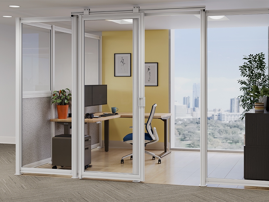 Spaces wall system in white with an UPLIFT L-Shaped Standing Desk and cobalt Envoke Ergonomic Chair.