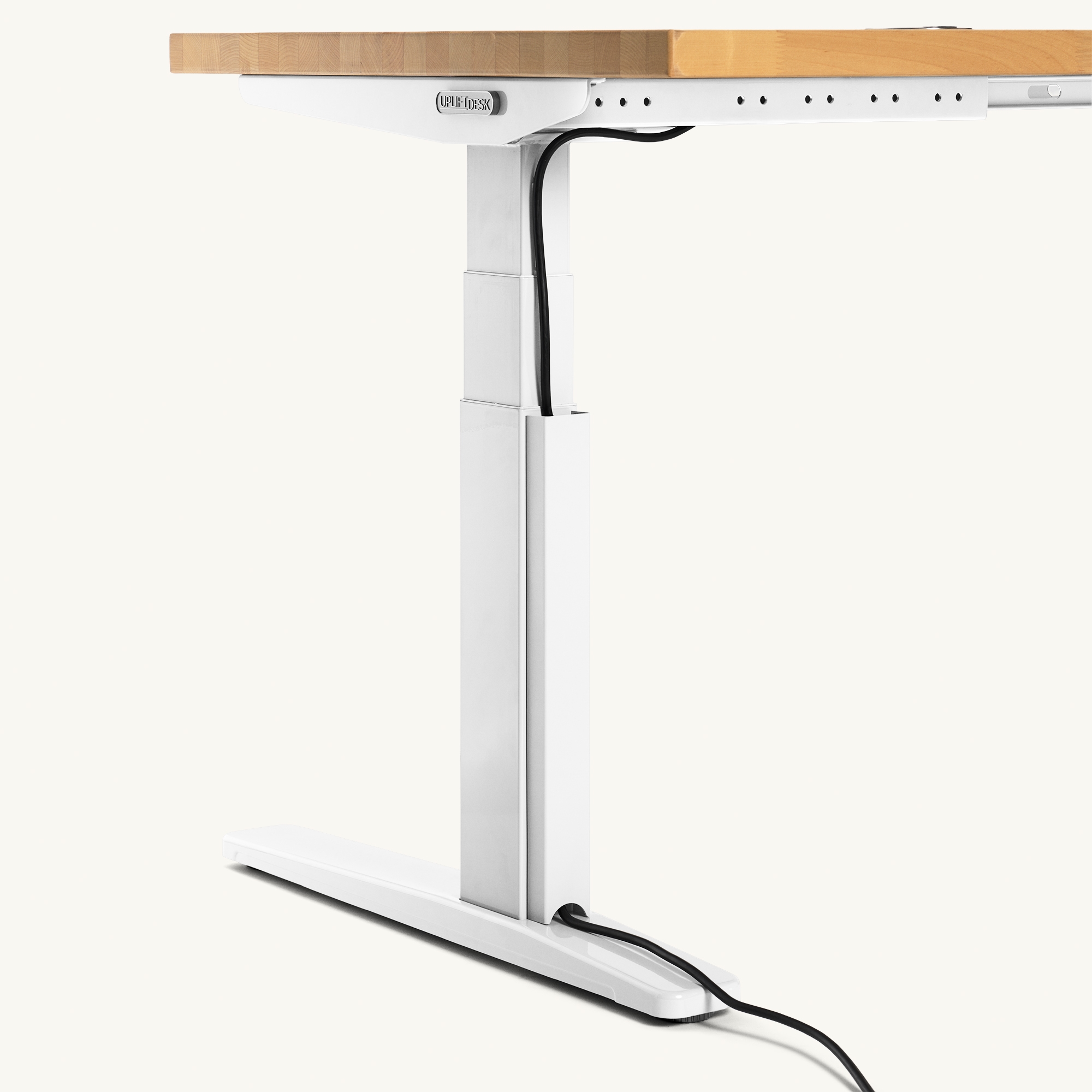 Magnetic Cable Channel attached to Uplift Standing Desk.