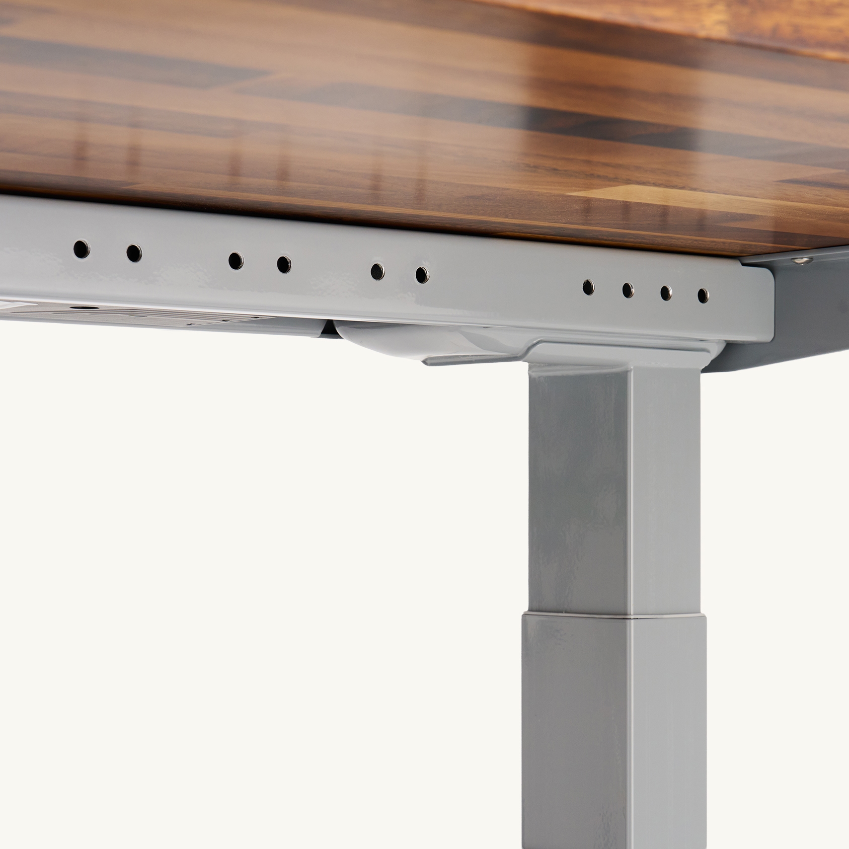Patented accessory mounting point on the Uplift V3 Standing Desk frame.