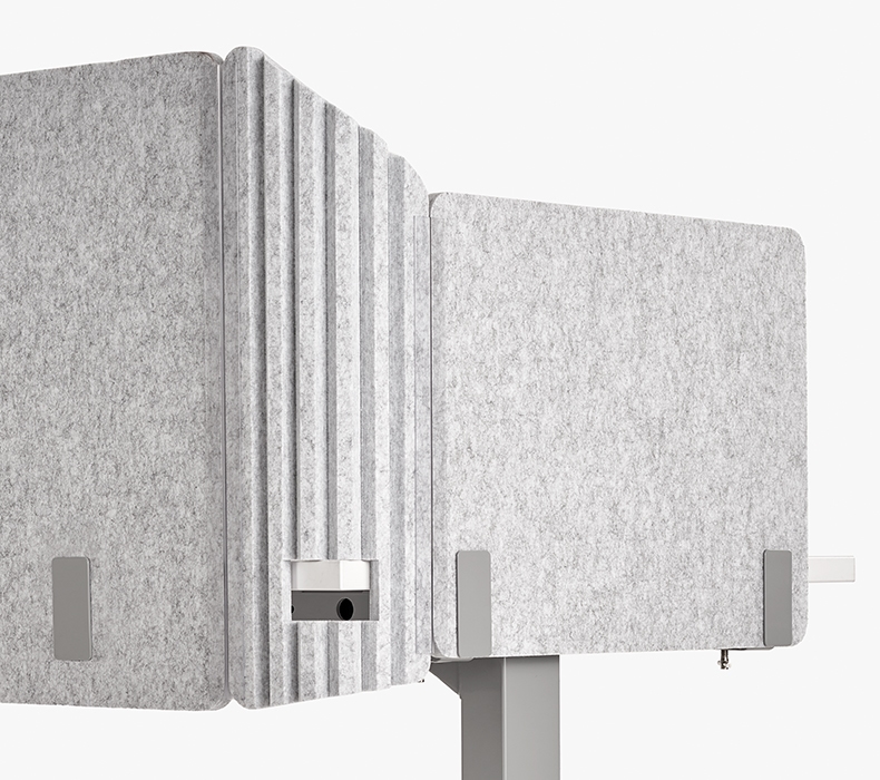 A close-up of a light gray Acoustic Privacy Panel Corner Insert by UPLIFT Desk