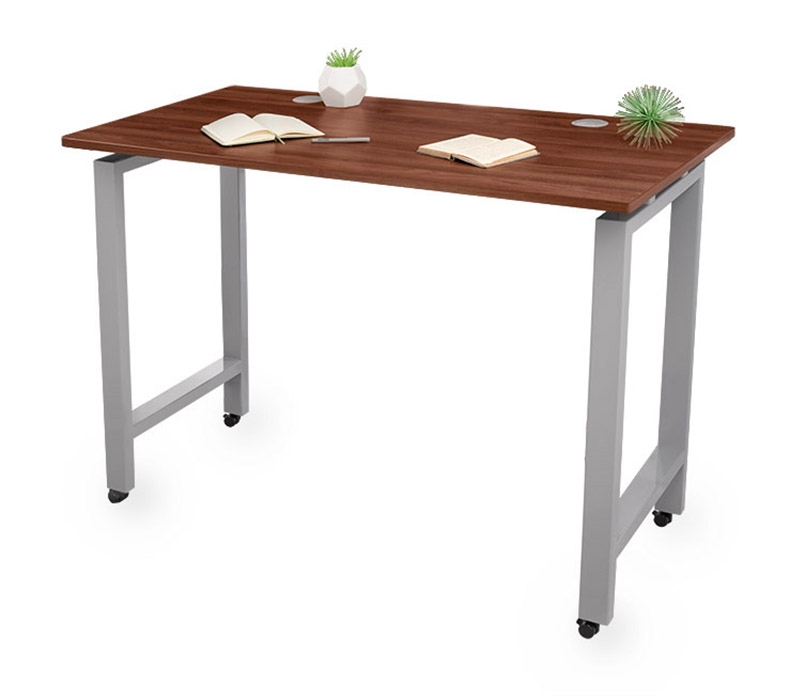 A walnut laminate offset standing height table desk with gray frame