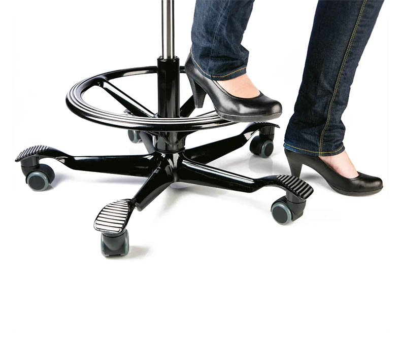 A person using the Hag Capisco Chair's foot ring to prevent their legs from dangling