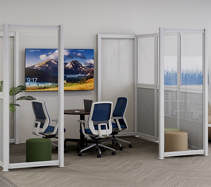 A semi-enclosed meeting space with three cobalt Envoke chairs, a Bistro Table, and full-height modular panels for privacy.