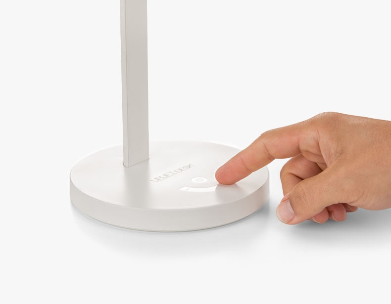 Adjusting the brightness on a white E3 LED Desk Lamp