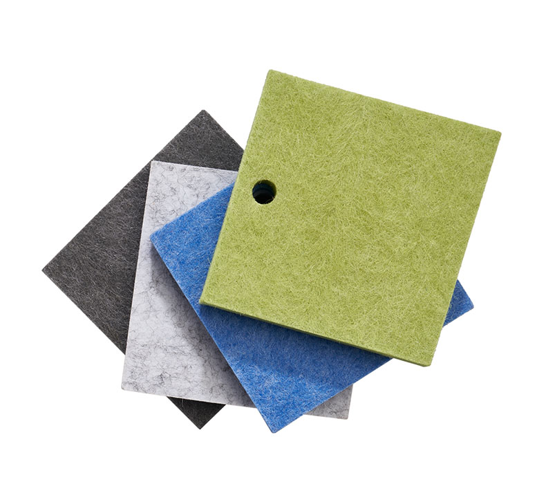 Four acoustic panel color samples in dark gray, light gray, lagoon blue, and green on the included chain