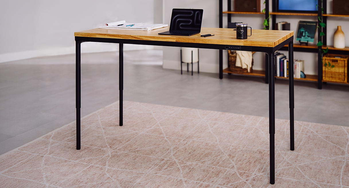 Parsons Standing Desk shown in a small home office