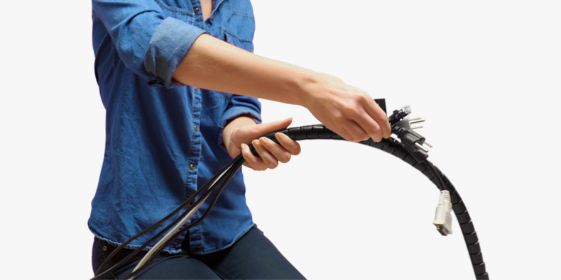 An UPLIFT Desk Cable Organizer coiled and ready for better desk cord organization.