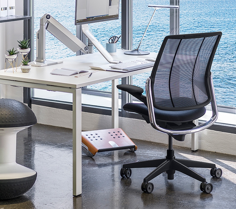A Humanscale Diffrient Smart Chair beside a desk