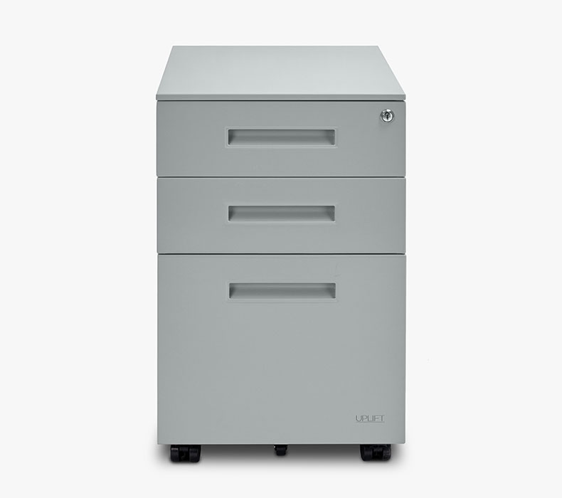 A gray filing cabinet for office storage