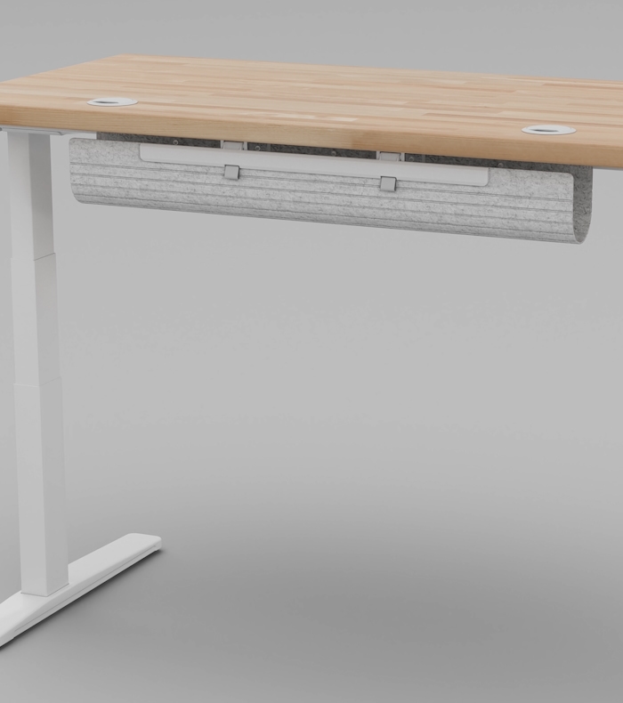 The FlexMount Cable Manager installed onto the back of an Uplift Standing Desk.
