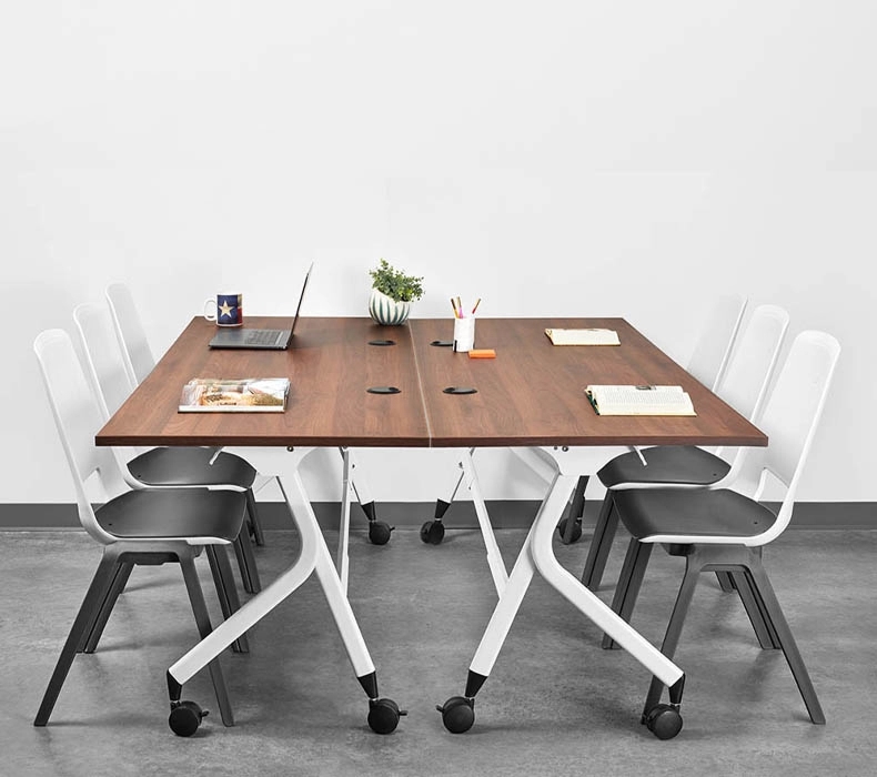 Two Flip Top tables by UPLIFT Desk joined together creating a conference area.