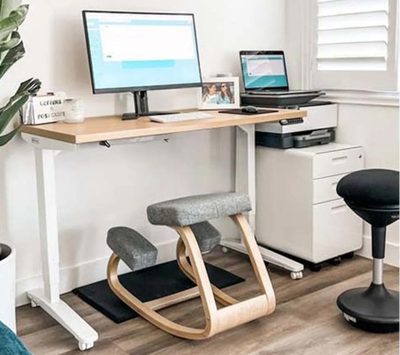 Small space featuring a standing desk, ergonomic seating, and various accessories from UPLIFT Desk.
